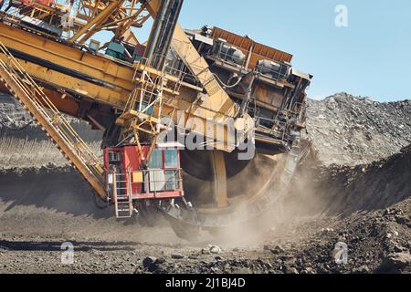 Coal mining in surface mine. Huge bucket excavator during mining. Stock Photo