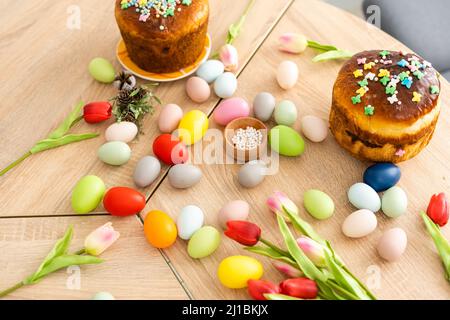 Easter cake and colorful eggs on festive Easter table Stock Photo