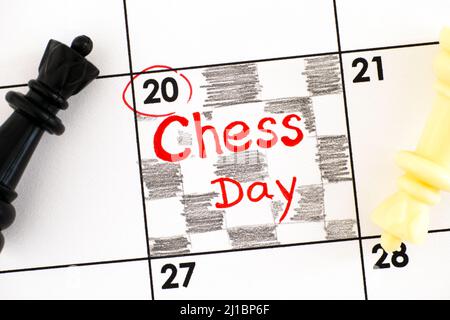 Reminder Chess Day in calendar with black and white chess pieces on it. July 20. Stock Photo