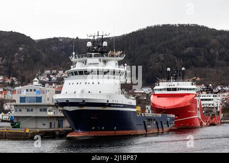 Offshore vessels Island Crusader (PSV), Aurora Saltfjord and Aurora Sandefjord  (AHTS) in the port of Bergen, Norway.  Berthed at Skoltegrunnskaien. Stock Photo