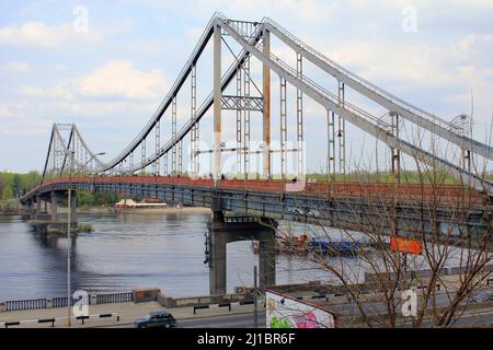 KIEV, UKRAINE - MAY 1, 2011: Park Bridge is a pedestrian cable-stayed bridge across the Dnieper to the recreation area. Stock Photo