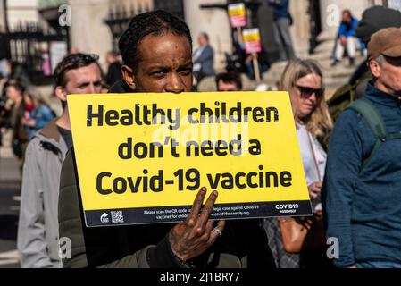 Protest taking place against vaccinating children for Covid 19, joined by anti-vaxxers. Placard stating healthy children don't need a Covid 19 vaccine Stock Photo