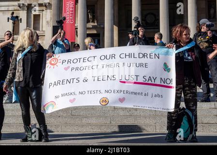 Protest taking place against vaccinating children for Covid 19, joined by anti-vaxxers. Protesters with banner stating just say no. No masks. No tests Stock Photo