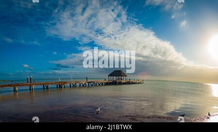 Holbox Island pier palapa sunset beach in Mexico Quintana roo Stock Photo
