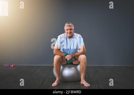 Im on the road to recovery. Full length portrait of a handsome senior man doing rehabilitative exercises. Stock Photo