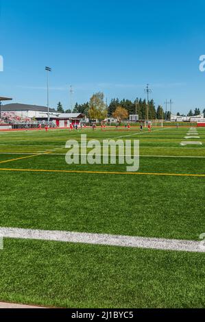 Girls' soccer players on the football/soccer field at David Douglas High School track and football field in Portland, Oregon. Stock Photo