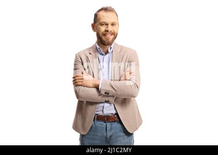 Cheerful professional man in a beige suit and jeans posing with crossed arms isolated on white background Stock Photo