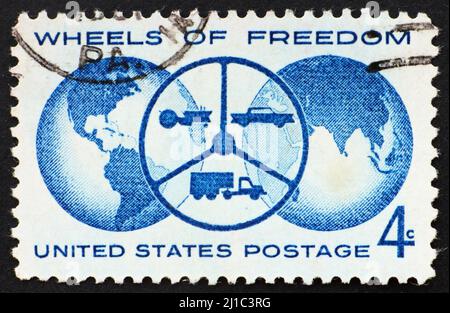 UNITED STATES OF AMERICA - CIRCA 1960: a stamp printed in the United States of America shows Globe and steering wheel with tractor, car and truck, Nat Stock Photo