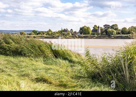 Looking across the River Severn at St Peters Church in the village of Upper Framilode from Rodley, Gloucestershire, England UK Stock Photo