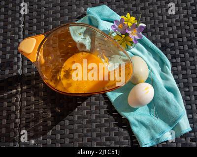 Blowing out eggs at Easter time Stock Photo