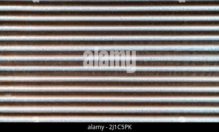 Gray metal shutters, real galvanized sheet metal texture, with deformations in the metal shutter surface Stock Photo