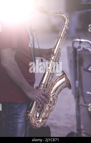 Musical instruments ,Saxophone Player hands Saxophonist playing jazz music. Alto sax musical instrument closeup Stock Photo