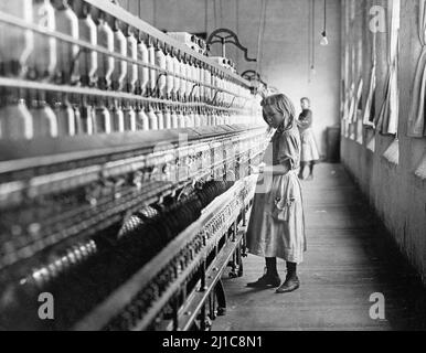 Sadie Pfeiffer, Spinner in Cotton Mill, North Carolina by Lewis Hine (1874-1940), 1908. The photograph shows a young girl working in a cotton mill as child labor Stock Photo