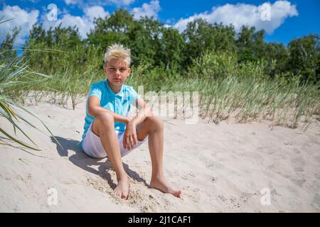 Teenager boy on summer vocation at the beach Stock Photo