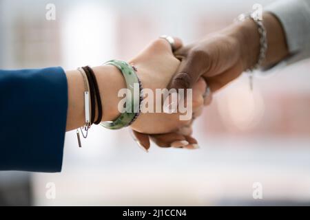 Close-up Of Two African People Shaking Hands Stock Photo