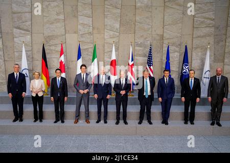 Brussels, Belgium. 24 March, 2022. U.S President Joe Biden stands with G& leaders for a group photo during the emergency meeting of the G7 nations at NATO headquarters, March 24, 2022 in Brussels, Belgium. Standing with from left to right are: NATO Secretary General Jens Stoltenberg, European Commission President Ursula von der Leyen, Japanese Prime Minister Fumio Kishida, Canadian Prime Minister Justin Trudeau, President Joe Biden, German Chancellor Olaf Scholz, British Prime Minister Boris Johnson, French President Emmanuel Macron, Italian Prime Minister Mario Draghi and European Council Pre Stock Photo