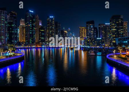 Dubai, UAE - Dec 05 2021: Panoramic night view of Dubai Marina bay; Best of Dubai wallpaper Stock Photo