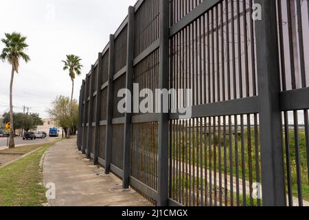 The Gateway International Bridge between Brownsville, Texas and Matamoros, Mexico, as seen through the border wall.  Viewed from Texas side of the wal Stock Photo