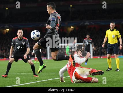 LONDON, ENGLAND - MARCH 7, 2017: Thiago Alcantara of Bayern (L) and Shkodran Mustafi (R) of Arsenal pictured in action during the second leg of the UEFA Champions League Round of 16 game between Arsenal FC and Bayern Munchen at Emirates Stadium. Copyright: Cosmin Iftode/Picstaff Stock Photo