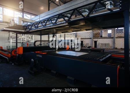 Working CNC laser cutting machine. Stock Photo