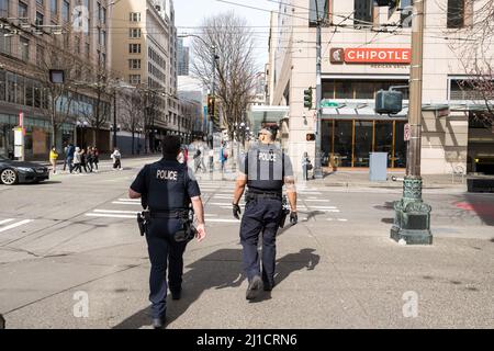 Seattle, USA. 24th Mar, 2022. Seattle police on 3rd and Pike due to an increase in violent crime in downtown. Amazon recently made headlines by telling employees working out of the Ivy building on 3rd and Pine, they can choose another location to work out of until the situation improves. Seattle police have set up a mobile police precinct by the tech giant. James Anderson/Alamy Live News Stock Photo