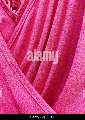 Pink mesh cloth, features seams, a lot of fit and different nuances of light Stock Photo