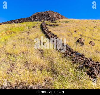 Lava Stone Fence Leading Uphill to Pu'ukohola Heiau National Historic Site, Hawaii Island, Hawaii, USA Stock Photo