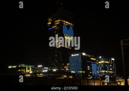 Gdansk, UK-14 Mar 2022: Night view of Olivia Business centre displaying a heart in Ukrainian flag colours of blue and yellow. Skyscraper in Gdansk sho Stock Photo