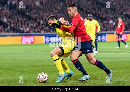 Lille, France - March 16: Hatem Ben Arfa of Lille (R) fights for the ball with César Azpilicueta of Chelsea (L) during the UEFA Champions League Round Stock Photo