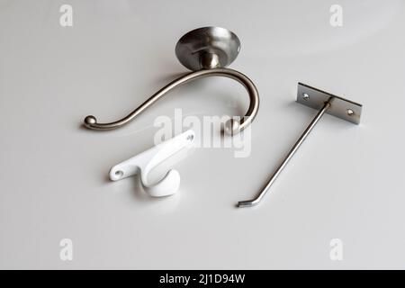 Different wall hooks on white background Stock Photo
