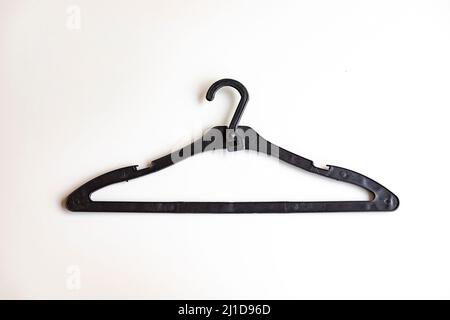 Black Plastic Coat Hanger Isolated On A White Background Stock Photo -  Download Image Now - iStock