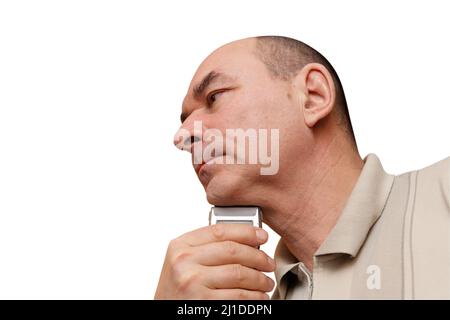 A mature man shaves his chin, isilated on white Stock Photo