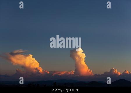 Cumulonimbus clouds over Tucson, Arizona in the Sonoran Desert at sunset during the summer storm season Stock Photo