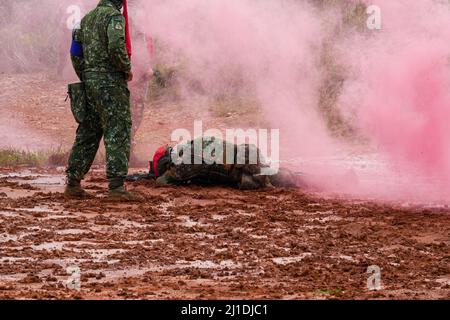 Taipei, Taiwan. 25th Mar, 2022. A soldier lies on the ground during the Army Special Aviation Department Tactical Mission Training session at a camp base in Hsinchu. The event is an Army Special Aviation Department Tactical Mission Training session and It's part of regular training sessions of the Army. Credit: SOPA Images Limited/Alamy Live News Stock Photo