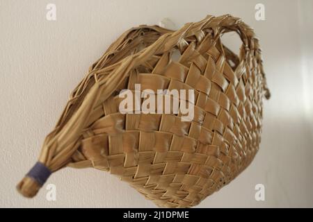 The Tolai basket - a traditional hand woven basket, from East New Britain (ENB), made from coconut tree leaves. Stock Photo