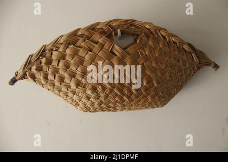 The Tolai basket - a traditional hand woven basket, from East New Britain (ENB), made from coconut tree leaves. Stock Photo