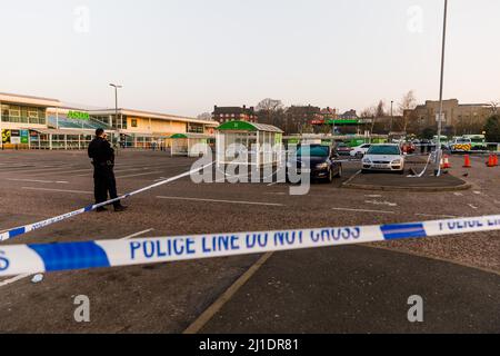 Wembley London, UK. 25th March 2022, A crime scene is still in place this morning after a man was left fighting for his life having been stabbed at Asda in Wembley. Police were called at 17:29hrs on Thursday, 24 March to reports of a stabbing at a Asda supermarket in Forty Lane, Wembley. Officers attended along with London Ambulance Service and found a man, aged in his 20s, with stab injuries. He was taken to hospital in a life-threatening condition. His next of kin are aware. Amanda Rose/Alamy Live News Stock Photo