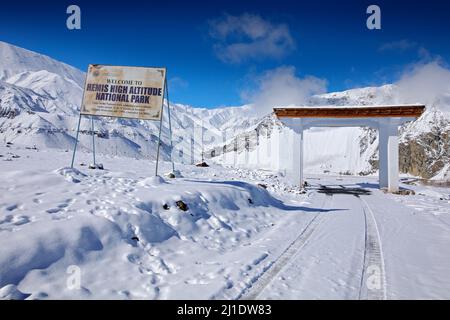 Entry gate to Hemis NP, Kashmir in India. Winter ladscape with road to National park. Road to Rumbak Valley and Yarutse, Hemis NP, Ladak, India. Snow Stock Photo