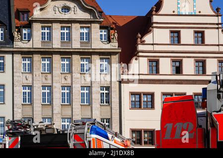 Fire engines stand during an operation on the market in the centre of Leipzig. Stock Photo