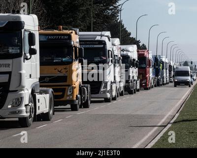 Burgos, Spain. 24th Mar, 2022. A line of trucks seen on Madrid-Irun Highway during the protest. Truckers join the transport strike as they pass through the city of Burgos. The strike is due to the rise in fuel prices and their working conditions, they have been paralyzing the country for a week. Credit: SOPA Images Limited/Alamy Live News Stock Photo