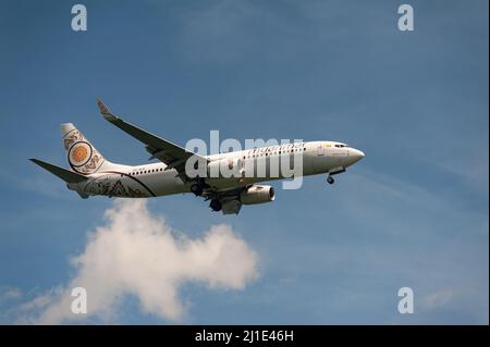 29.11.2021, Singapore, , Singapore - A passenger aircraft of Myanmar National Airlines of type Boeing 737-800 with registration XY-ALB on approach to Stock Photo