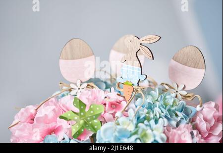 Figures of a hare and eggs made of wood for Easter decoration Stock Photo