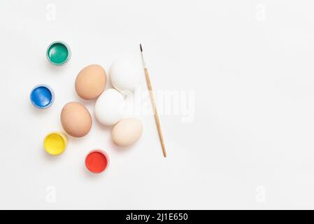 Eggs and paints for Easter on a white background Stock Photo