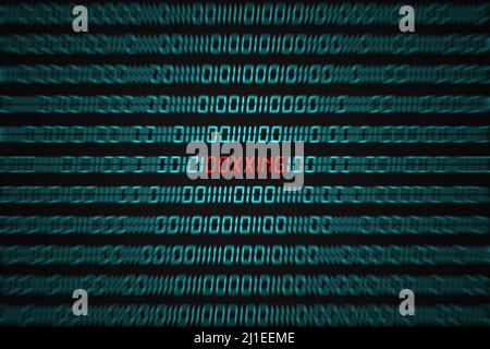 Red word "Doxxing" hidden in the middle of a binary code sequence. Stock Photo