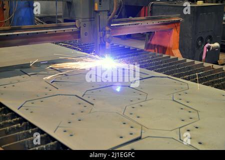 Machine for plasma cutting of metal. The process of cutting metal using plasma cutting. Metal cutting. Stock Photo