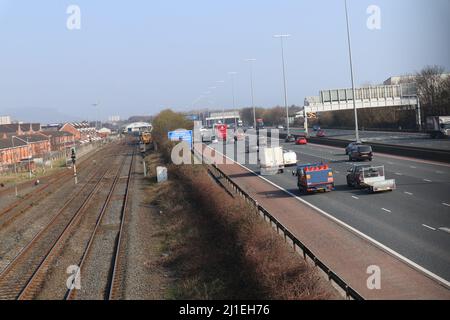 Railway and motorway running parallel Stock Photo