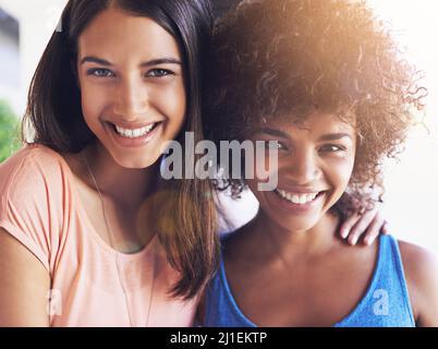Best friends bring out the best in each other. Shot of two girlfriends hanging out together. Stock Photo