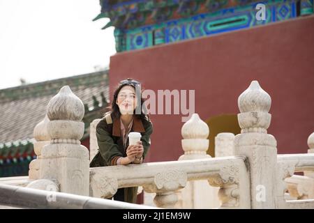 Young woman tourist standing on ancient arch bridge - stock photo Stock Photo
