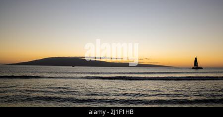 A beautiful sunset view over Maui Island in Hawai of Lanai from Kaanapali Beach Stock Photo