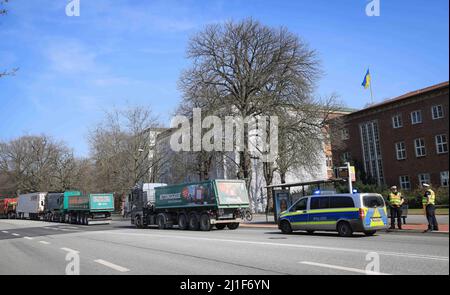 Kiel, Germany. 25th Mar, 2022. Trucks stand in front of the state house during a protest against high fuel prices during a state parliament session. The demonstration with numerous vehicles led to traffic obstructions in Kiel. Credit: Christian Charisius/dpa/Alamy Live News Stock Photo